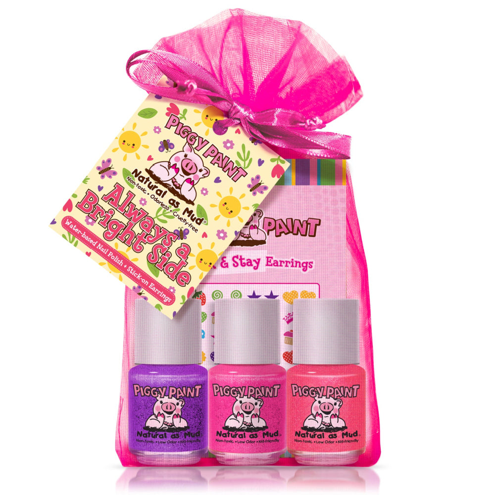 Piggy Paint nail polish set with pink gift bag and tag on a white background