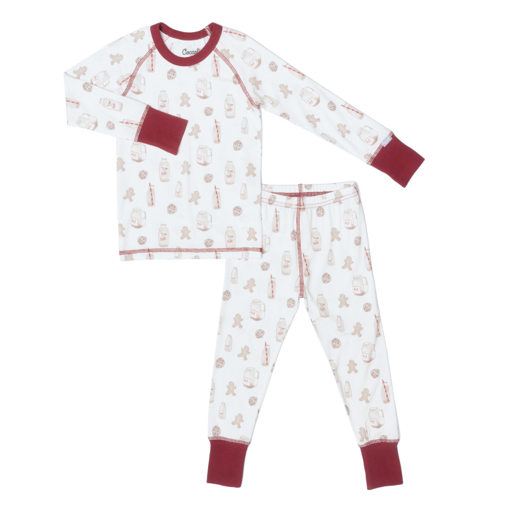 Children's pajama set with gingerbread men pattern on a white background