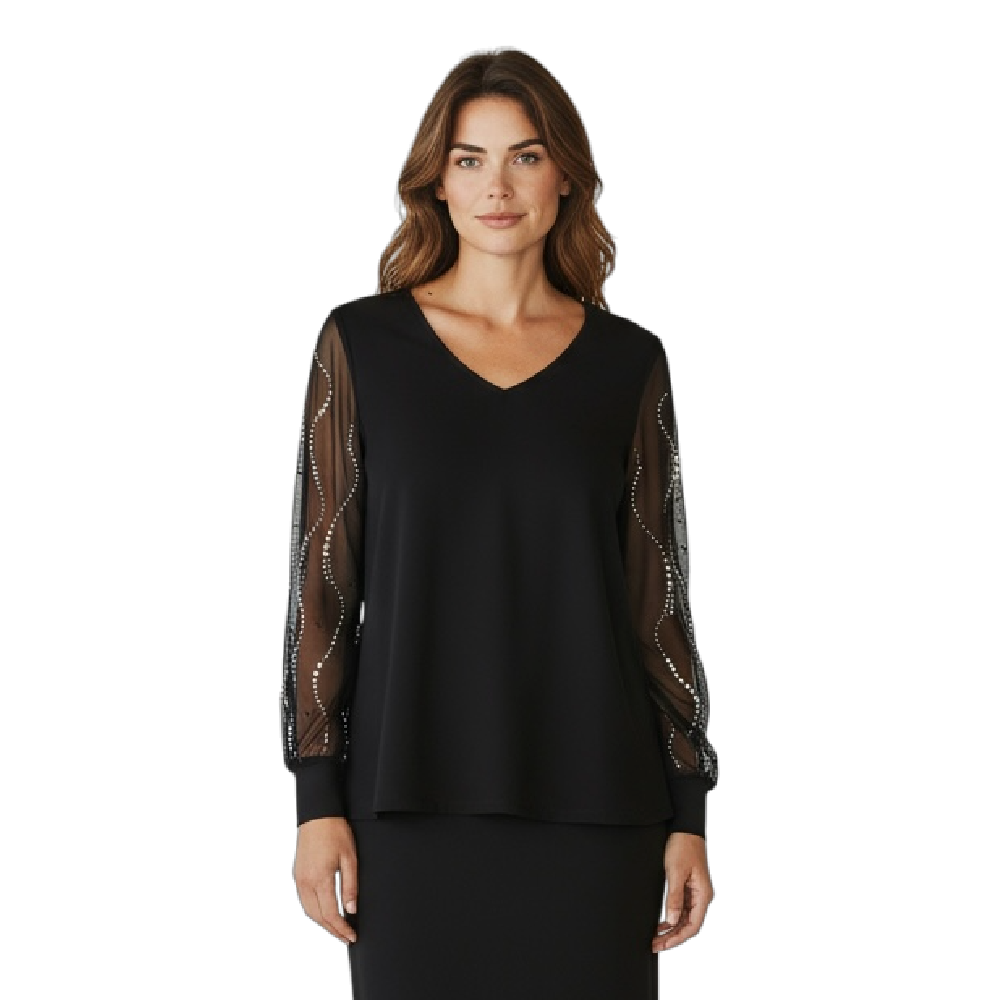 Woman wearing a black dress with sheer sleeves on a white background